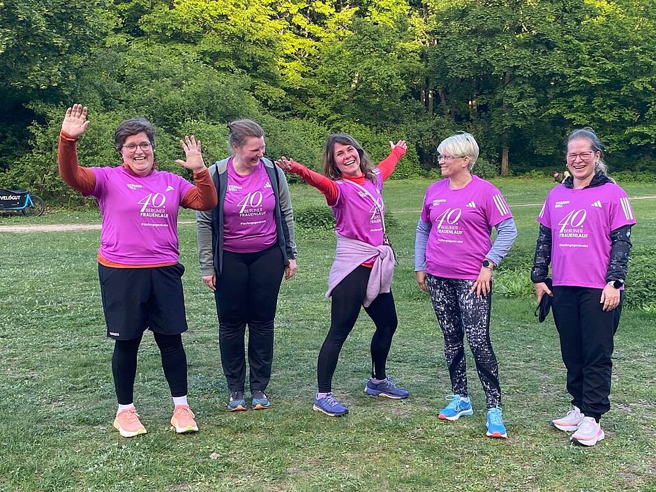 Group photo of a happy women's race training group.