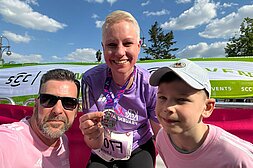 Happy at the finish line with her family