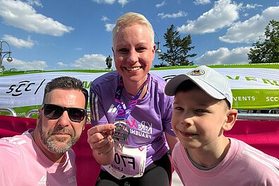 Happy at the finish line with her family