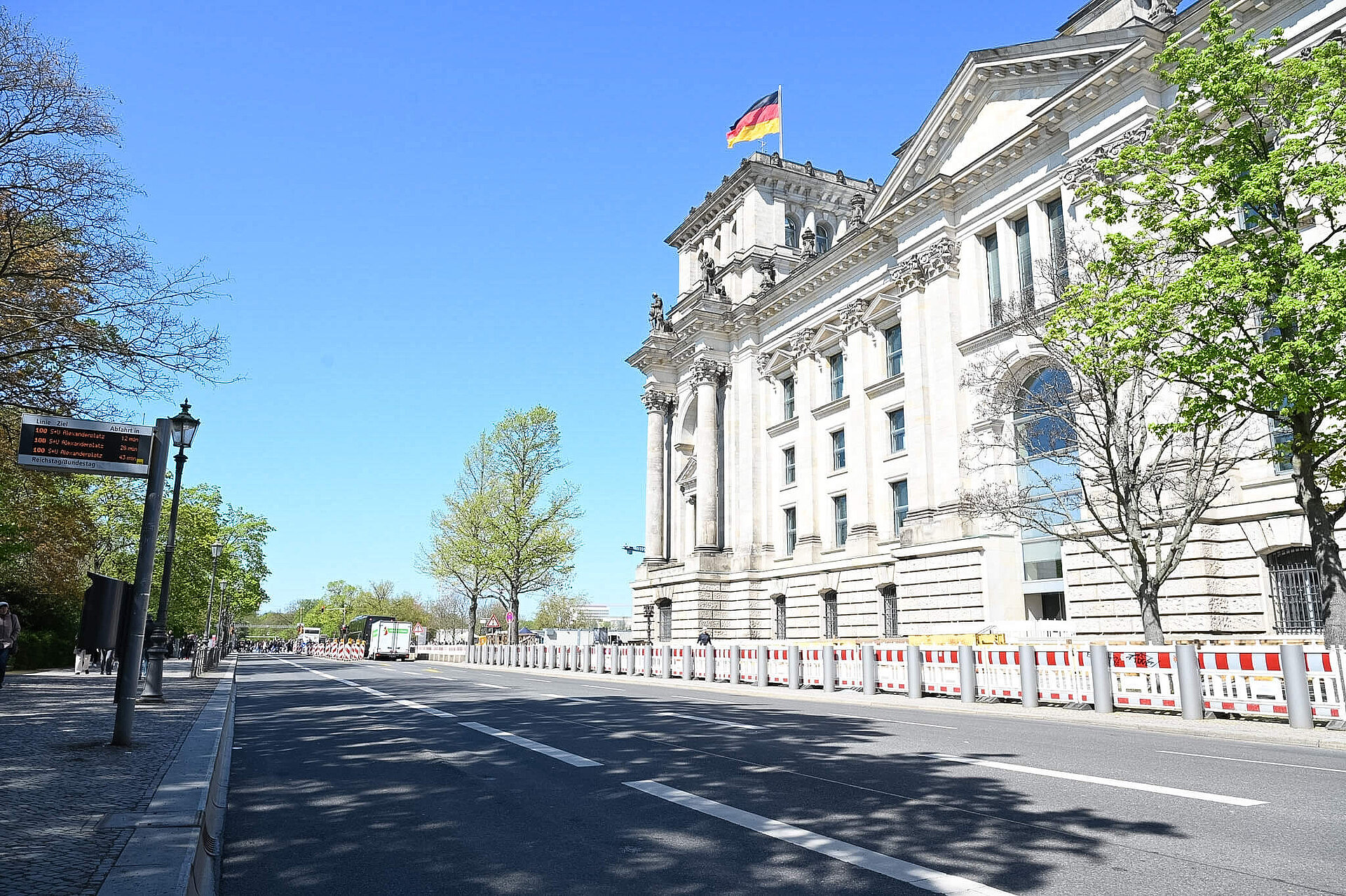 Barriers in front of the Reichstag building on the street.